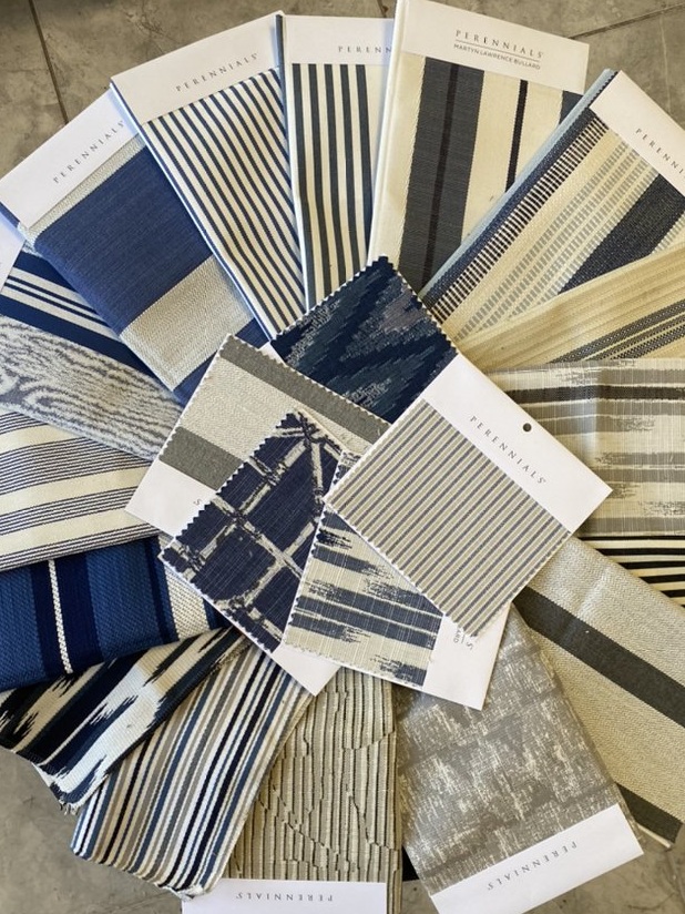 Perennials performance stripe fabrics in spa blue, navy and grey in the Capistrano Upholstery shop
